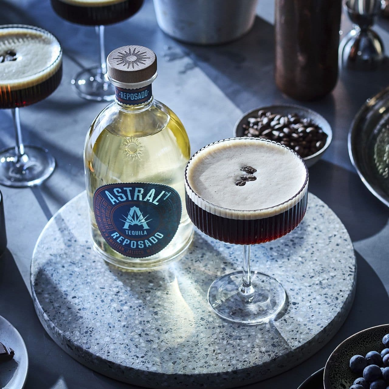 Cold Brewtini cocktail in glass; coffee beans as garnish