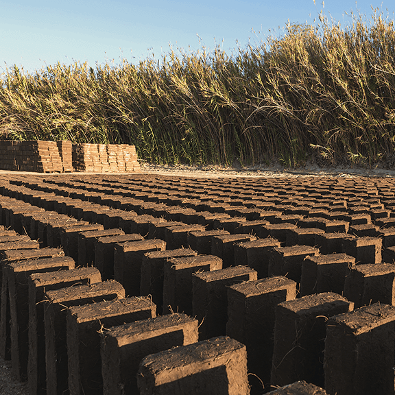A field of stacked adobe bricks 